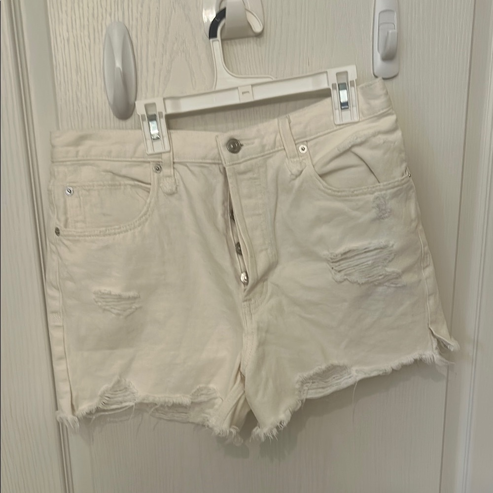 We the free white denim cut off shorts. Size 30 button fly 4 inch in seam